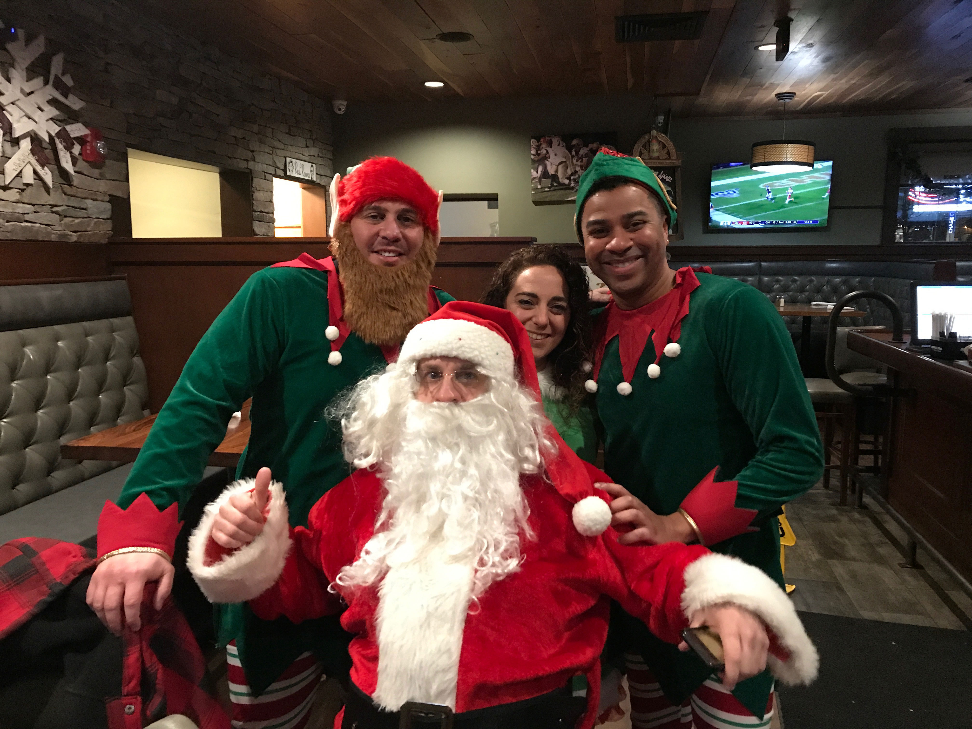 Volunteers preparing Christmas gifts for families